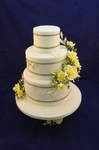 stacked wedding cake yellow flowers